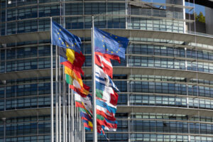 STRASBOURG, FRANCE - JUNE 23, 2018: All EU Flags European Union flag waving in front of European Parliament, headquarter of the European Commission European Parliament